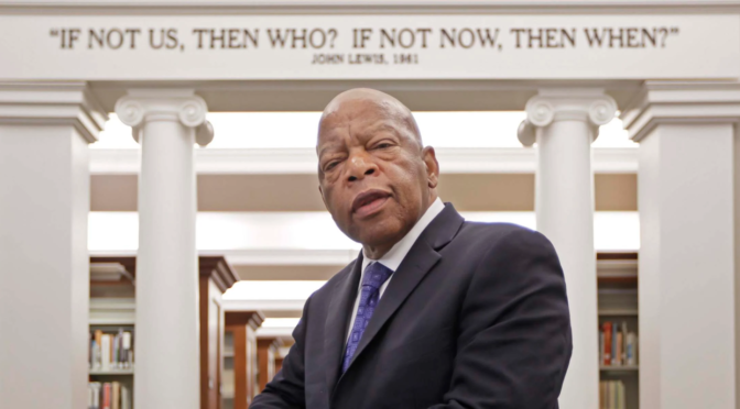 John Lewis, standing in front of columns that say "If not us, then who? If not now, then when?"