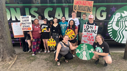 Individuals on Strike outside the Starbucks strike bus.